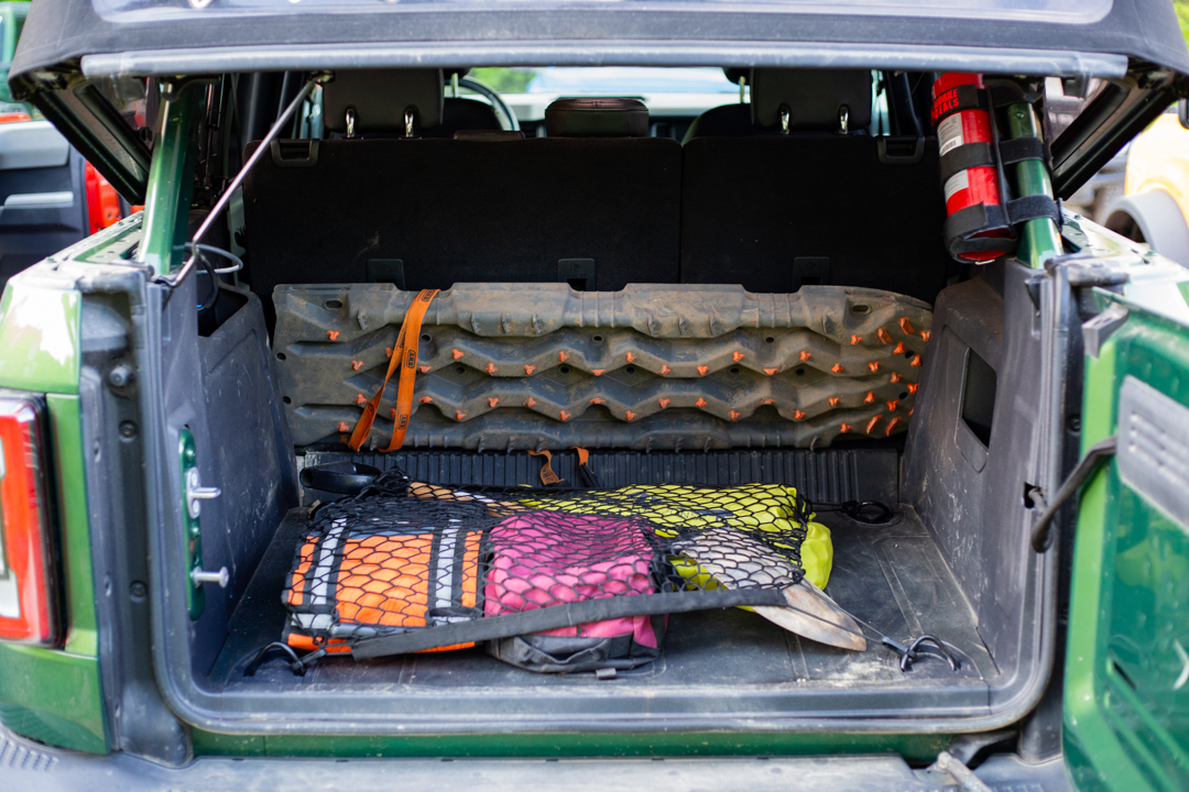 packed gear in the truck of a ford bronco