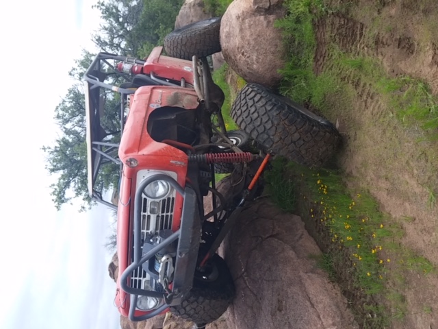 red classic ford bronco flexing wheel